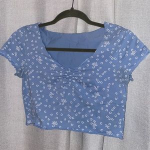 Blue top with white flowers pattern